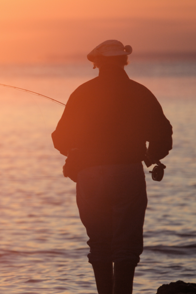 fly fishing at sunset